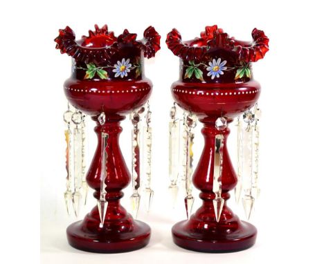 A Pair of Ruby Glass Table Lustres, circa 1890, with frilled rims, painted foliate bands and prismatic drops, on circular fee