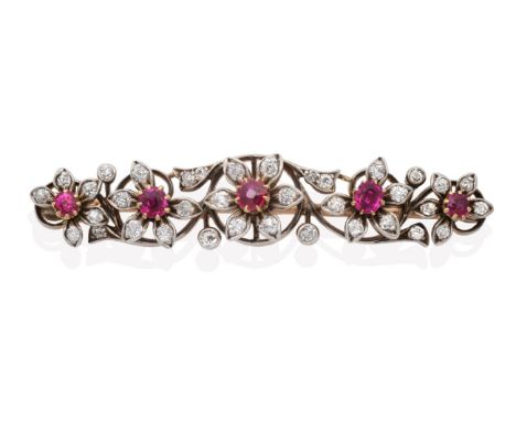 A Ruby and Diamond Brooch, five flower heads, each with a central round cut ruby in a claw setting to old cut diamond set pet