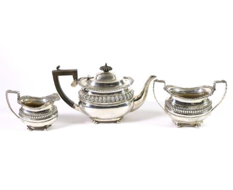 An Edwardian Silver Three Piece Bachelor's Tea Service Nathan & Hayes, Chester 1904, rounded oval and part fluted, with folia