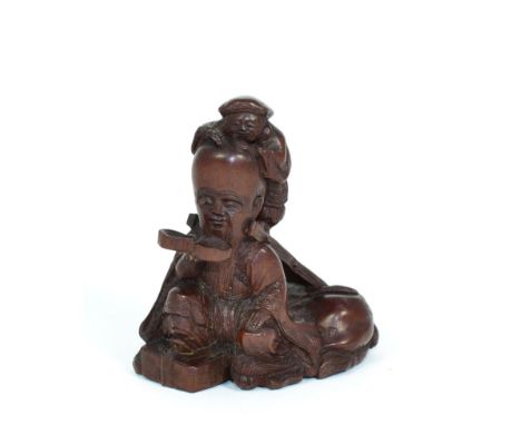 A Japanese Carved Wood Netsuke, Meiji period, as Daikoku and Fukurokujin, 6cm high