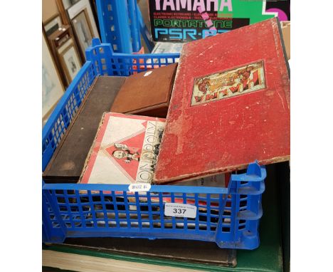 A box of vintage games and a Pergamon World Atlas. 