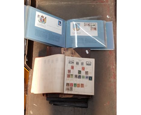 2 folders of first day covers, 2 stamp albums and a stock book 
