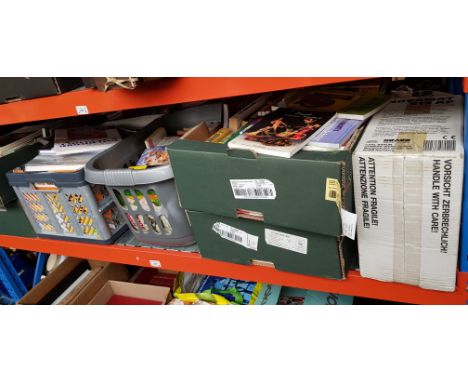 6 boxes of books and a slide projector 