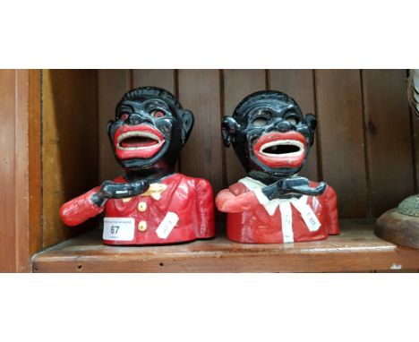 2 cast money boxes.Note:- These items are listed on the basis they are illustrative of a bygone culture in which there were d