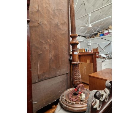 A carved and stained beech standard lamp. 