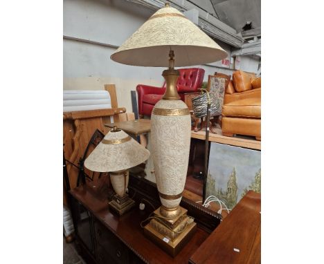 A large floor standing lamp and table lamp matching.