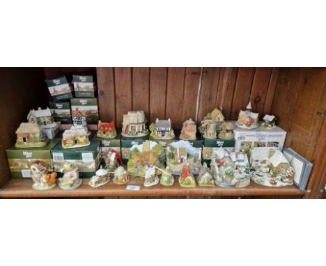 Mainly Liliput lane model houses with deeds including winter scenes, together with two Royal Albert/Beswick Beatrix Potter fi