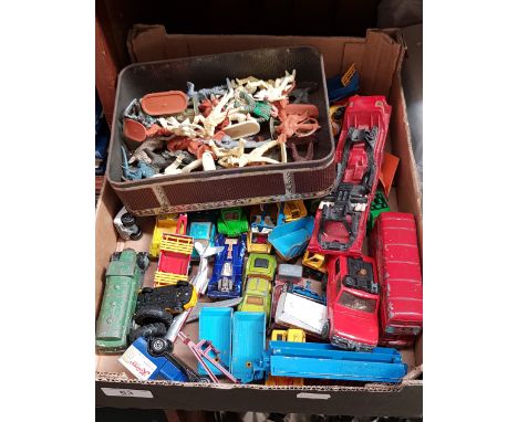 A box of die-cast model vehicles and plastic army and Native American figures 