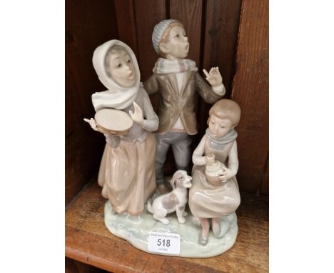 Lladro figure group - children and dog singingCondition:- Pony tail missing & top of stick cut from girl, no sign of any othe