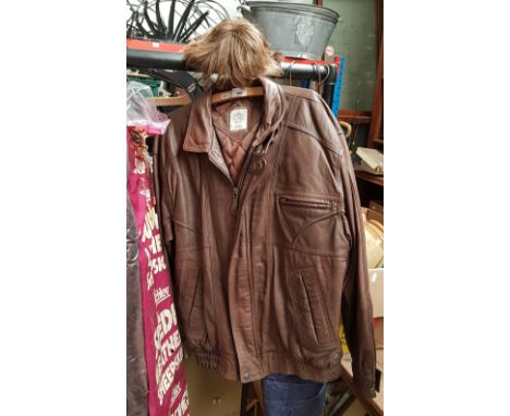 A vintage men's brown leather together with a man's wig by Rene, Paris. 