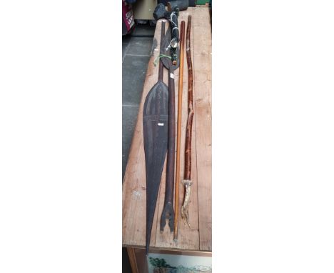 A snooker cue, walking stick, 2 shillelagh, 2 tribal spears 