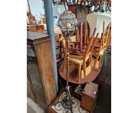 A brass and wrought metal adjustable lamp. 