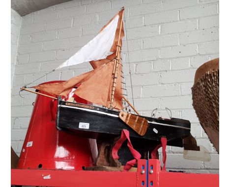 A wooden model boat on plinth - 19th century Thames barge with motor 