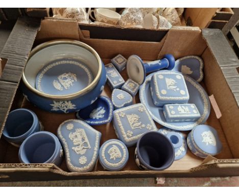 A box of blue blue Wedgwood Jasper ware including trinket boxes, candlesticks etc. 