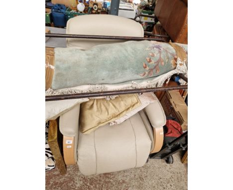 A light grey leather electric reclining and swivel lounge chair.
