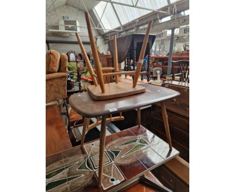 An Ercol table and chair. 