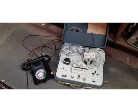 A vintage black bakelite telephone and a Dansette Consort 4 reel to reel player. 