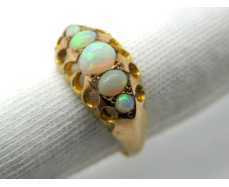 A 9ct Gold Five Stone Opal Ring, graduated oval cabochon set. 