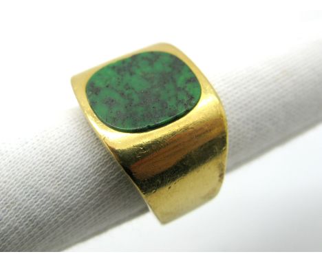 A Gent's Hardstone Inset Ring, the cushion shape panel rubover inset between wide plain tapering shoulders, indistinctly stam