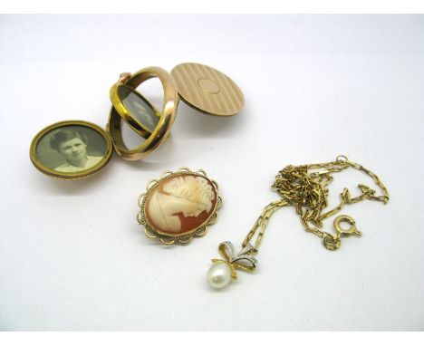 An Engine Turned Circular Locket Pendant, hinged front and back with swivel interior, together with a 9ct gold oval cameo bro