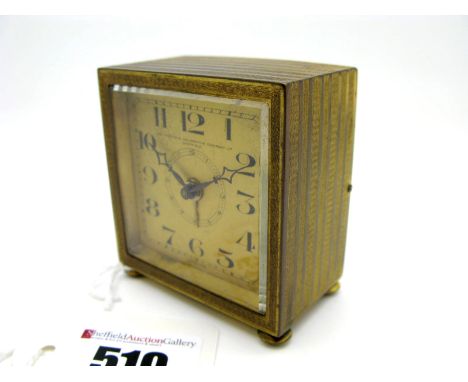 A Small Square Cased Bedside Clock, the signed dial "The Sheffield Goldsmiths Company Ltd Sheffield" with black Arabic numera