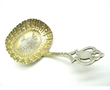 A Highly Decorative Hallmarked Silver Caddy Spoon, Chaplin & Sons, London 1900, the shaped textured oval bowl with engraved d