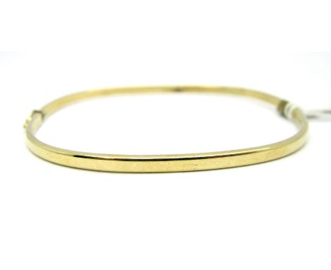 A Modern 9ct Gold Bangle, of plain square design, hinged to snap clasp. 