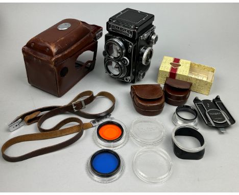 ROLLEIFLEX 2.8 E Camera in original case with neck strap and lens hood (full working order) along with various accessories to