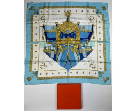 AN HERMES SILK SCARF 'VUE DU CARROSSE DE LA GALERE LA REALE' IN ORIGINAL BOX, apparently unused 