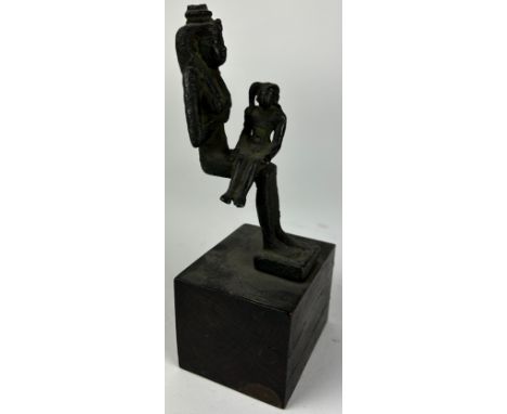 A BRONZE EGYPTIAN STATUETTE OF GODDESS ISIS AND HER CHILD HORUS, after the antique but possibly of the period. Mounted on woo