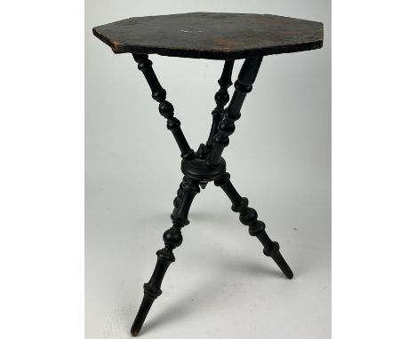 A VICTORIAN EBONISED SIDE TABLE WITH UNUSUAL TRIPOD SUPPORTS AND BASE65cm in height x 45cm in width 