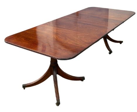 A TWIN PEDESTAL MAHOGANY DINING TABLE PROBABLY BY WILLIAM TILLMAN, two removable leaves, along with six Chippendale design ch