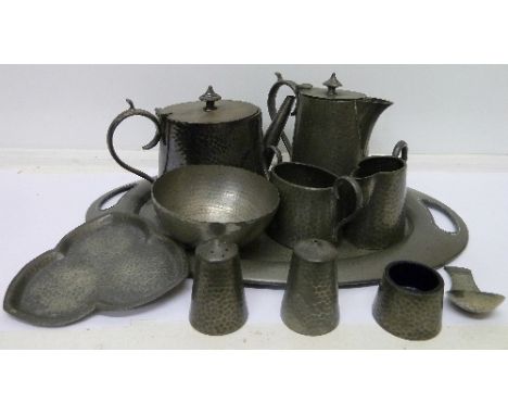 A three piece pewter tea service by Hutton, Sheffield, a James Dixon & Sons pewter tray, a pewter condiment set, jug and bowl