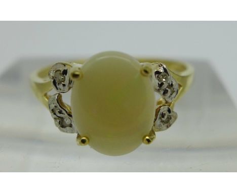 A 9ct gold, opal and diamond ring, weight 1.3g, size O