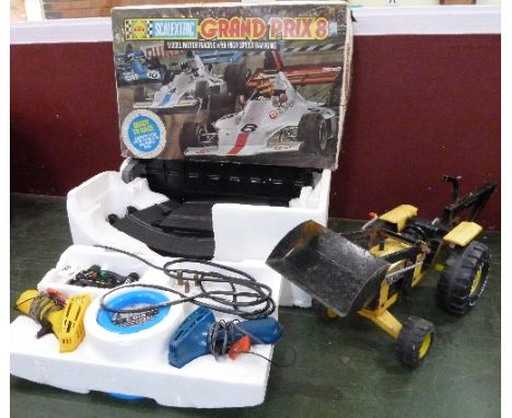 A Scalextric Grand Prix 8 model motor racing set and a Tonka toy
