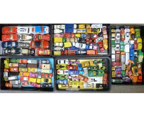 A collection of die-cast model vehicles, playworn