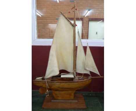 A model pond yacht with stand