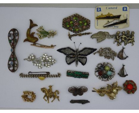 Costume brooches including one set with opal and two Cunard QEII pin badges