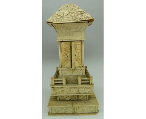 A Japanese carved model shrine with two doors revealing Buddha, a/f, height 20cm