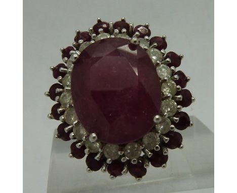 A 14ct white gold, ruby and white stone cluster ring, weight 10g, size O