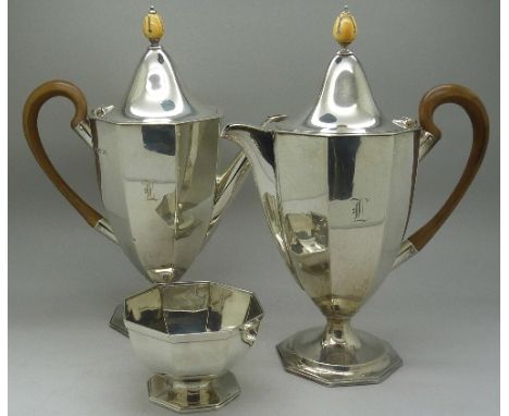 A matching silver coffee pot, water jug and sugar with carved ivory finials, London 1938, Goldsmiths & Silversmiths Company, 