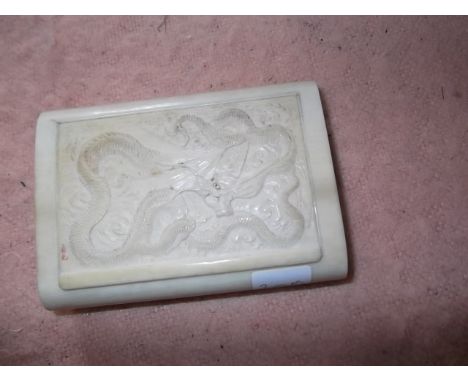 Carved ivory small snuff box, lid depicting 3 clawed dragon