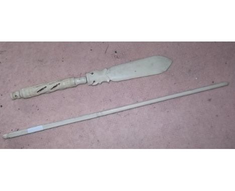 A carved ivory paperknife with pierced handle and a chop stick