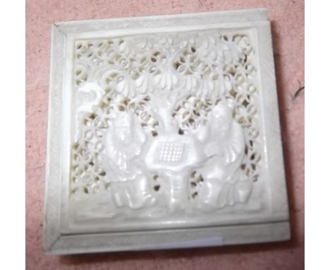 A small carved & pierced ivory box with sliding lid contain 7 carved & pierced ivory panels as a puzzle. The lid depicts two 