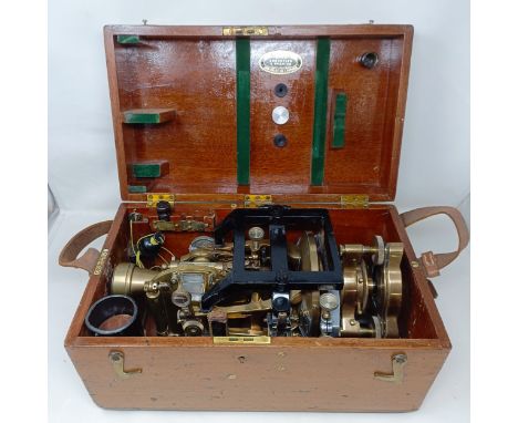 A theodolite, cased, with a tripod (2)