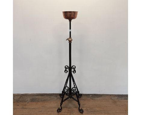 A copper milk churn, with a ring handle, 54 cm high and a painted metal adjustable stand (2)