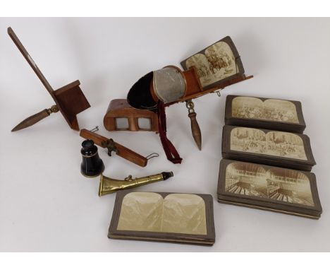 A stereoscopic viewer, another, various cards and a monocular