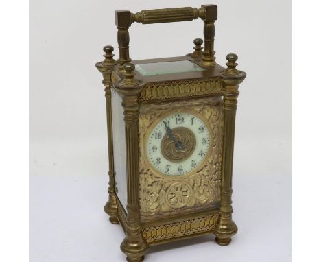 Brass French carriage clock with enamelled dial and key, working at lotting, H:18cm. UK P&amp;P Group 2 (£20+VAT for the firs