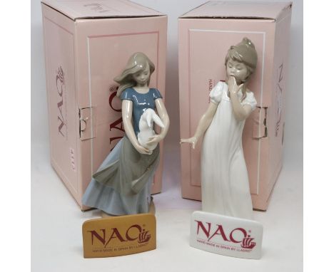 Two Nao figurines, boxed, and two ceramic Nao name tags, no cracks or chips, largest H: 29 cm. UK P&amp;P Group 3 (£30+VAT fo