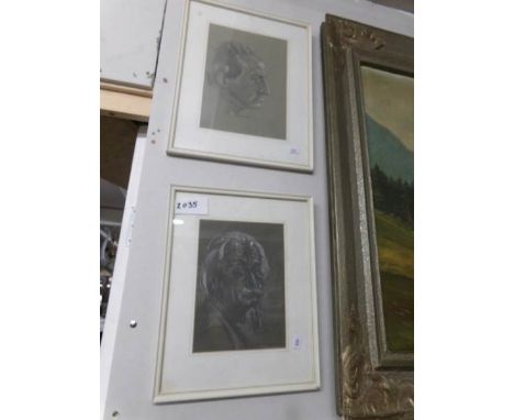 A framed and glazed portrait of Albert Einstein and one other.